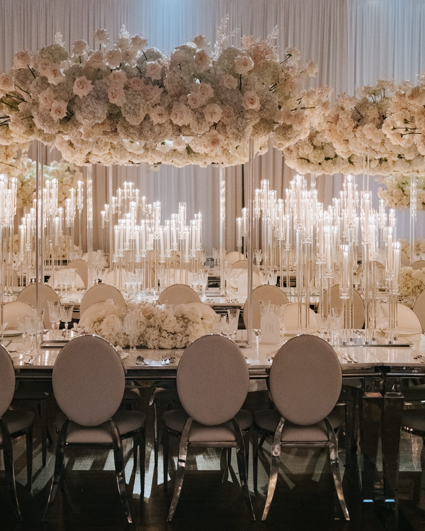 Floating Blush Canopy - Suspended blush and ivory rose canopy above mirrored long tables and towering crystal taper candelabras by Aura Floral Design Miami