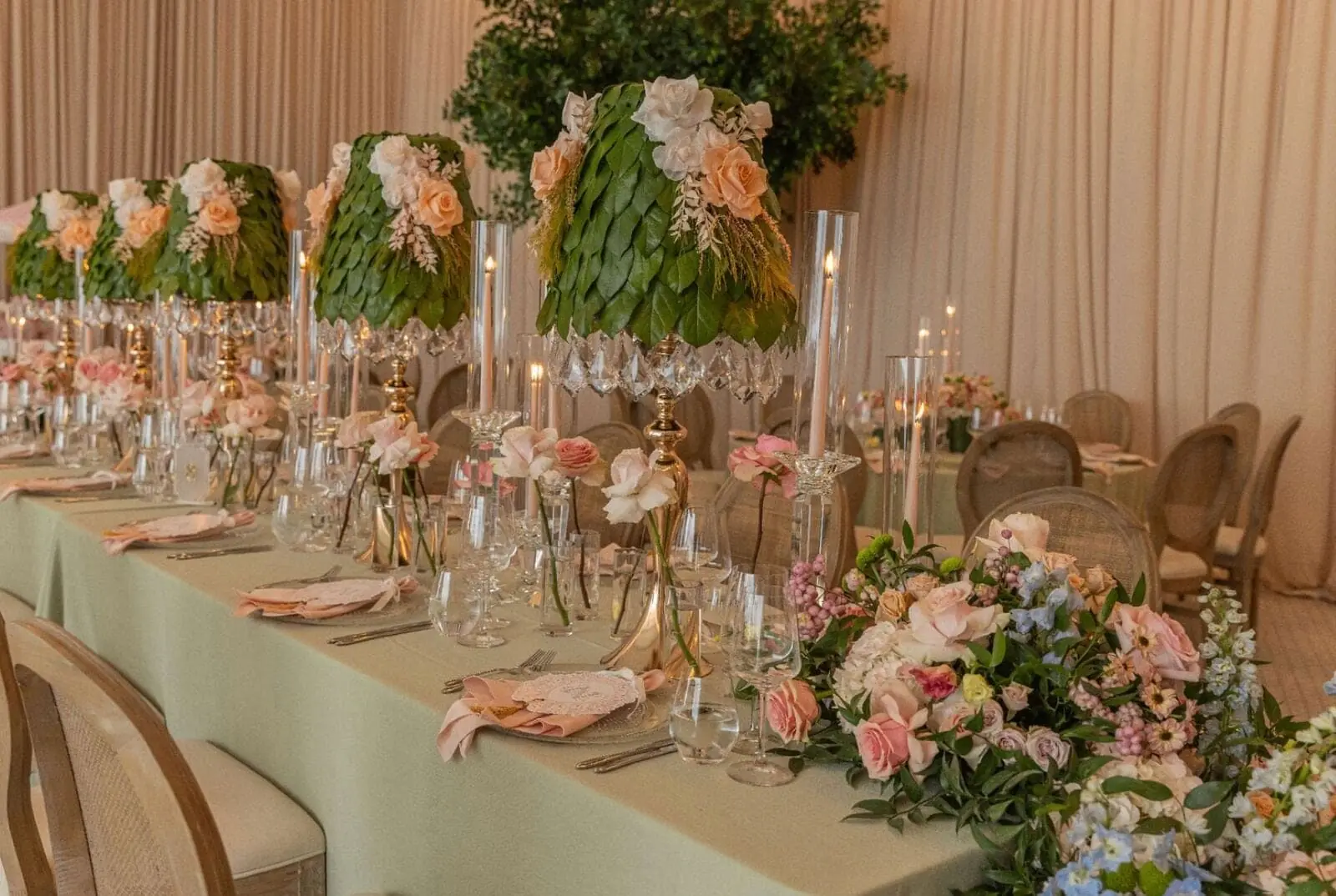 Leaf Lampshade Centerpieces - Sculptural leaf-and-rose lampshades with crystal candelabras along a sage tablescape by Aura Design Flowers Miami