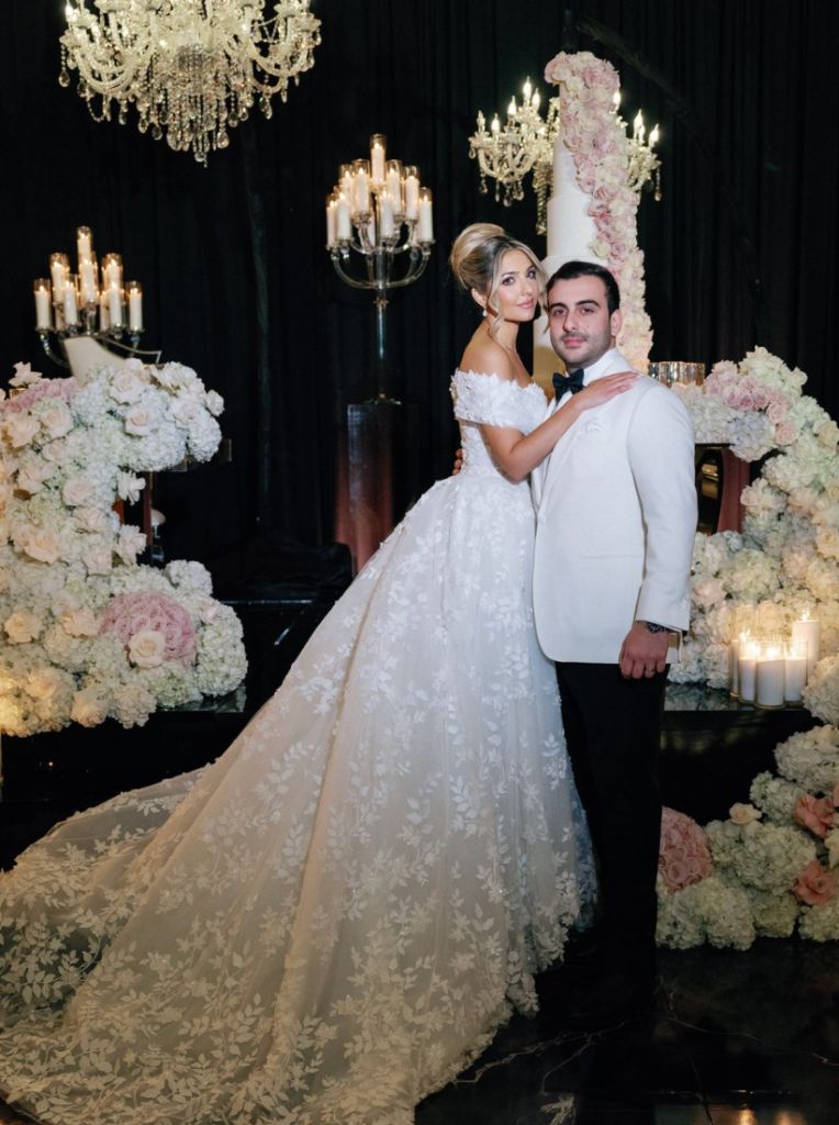 Black Tie Reception - Dramatic chandelier backdrop with towering floral cake by Aura Floral Design Miami
